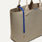 The Lighweight Tote in Soft Sesame shown with its handy key leash.