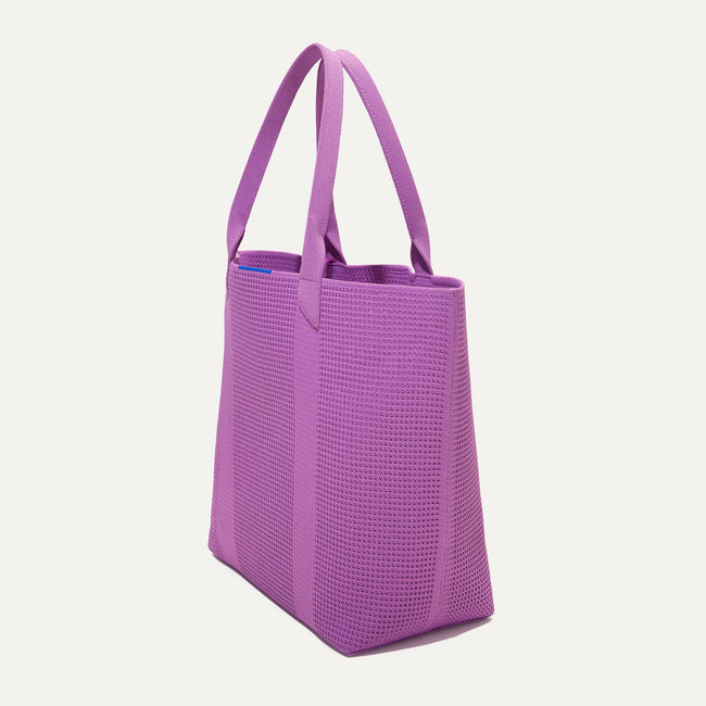The Lightweight Tote in Summer Berry shown in diagonal view. 