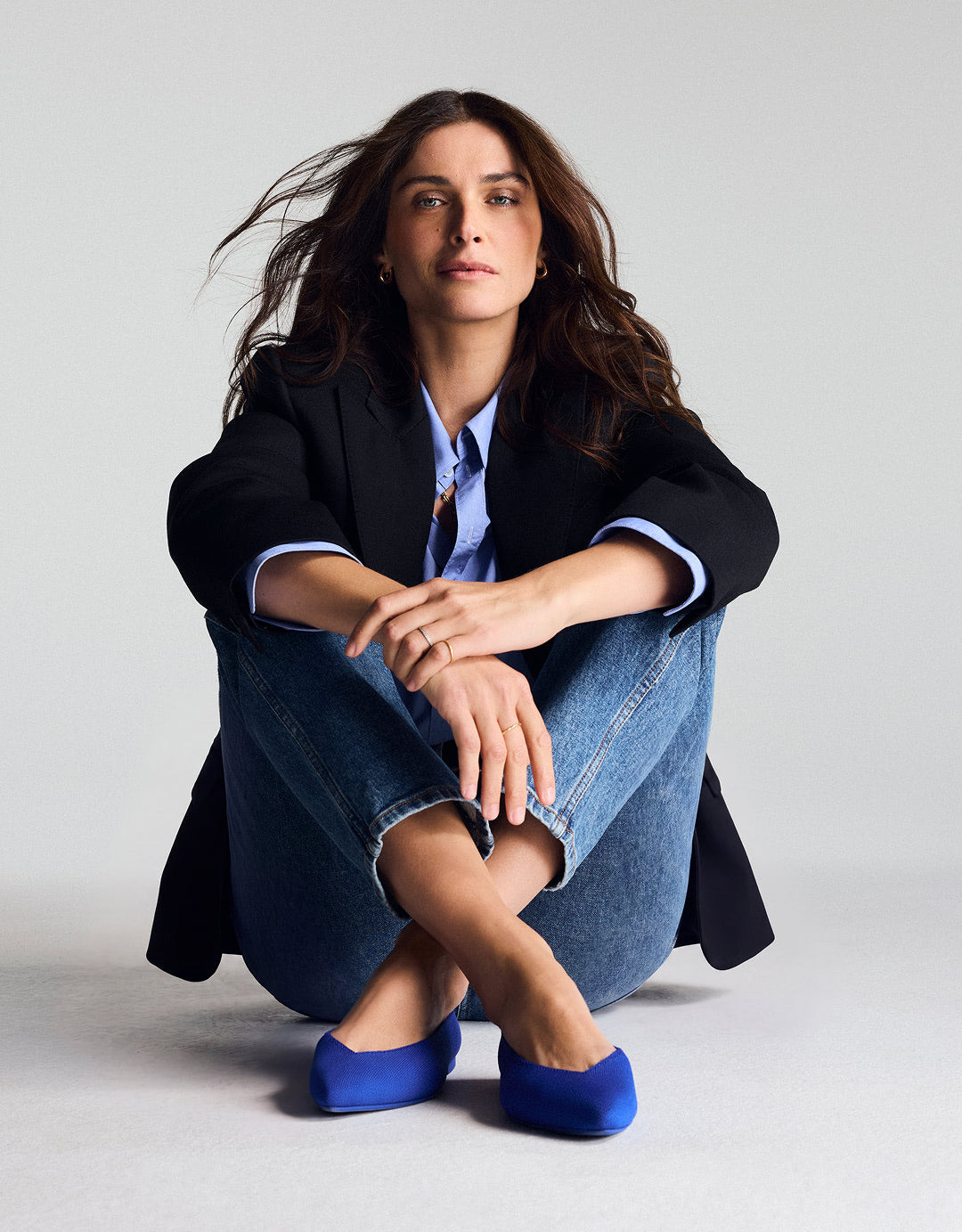 Woman wearing The Point III in Rothy's Blue.