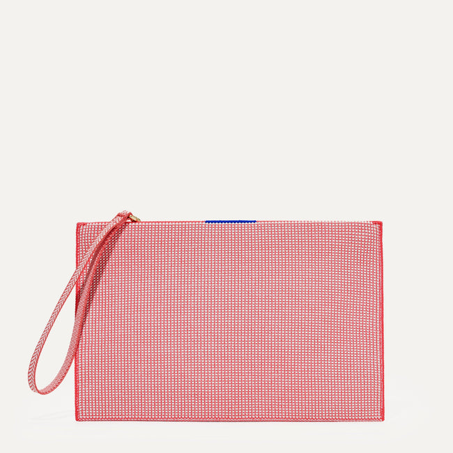 The Wristlet in Coral Grid shown from the front.