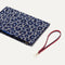 The Wristlet in Indigo Cat shown with the wrist strap detached.