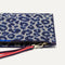 Close up of the zipper closure and wrist strap of The Wristlet in Indigo Cat.