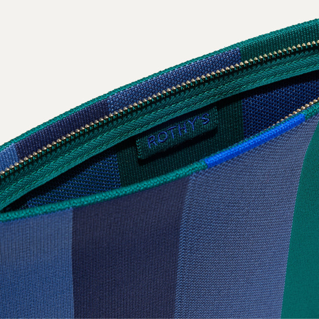 The Wristlet in Ivy Rugby Stripe interior view with Rothy's halo detail.