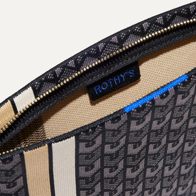 The Wristlet in Signature Black interior view with Rothy's halo detail.