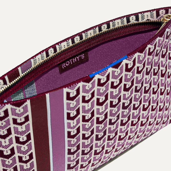 The Wristlet in Signature Plum interior view with Rothy's halo detail.