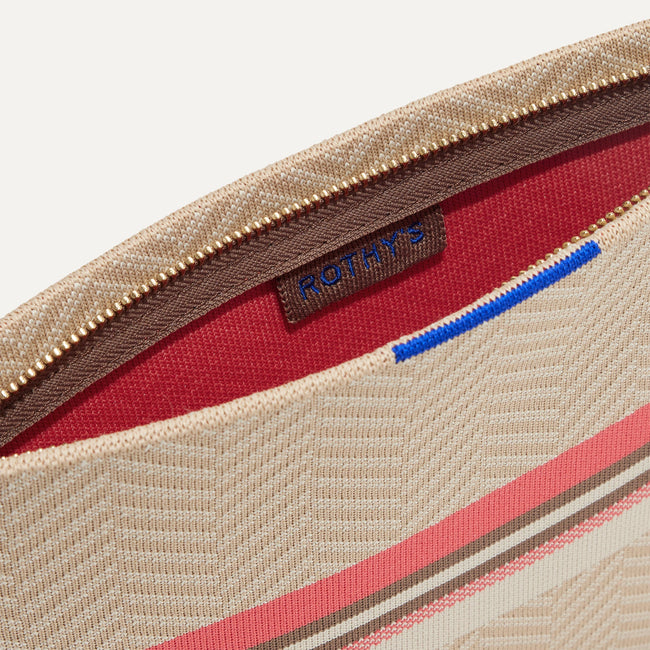 The Wristlet in Sunkissed interior view with Rothy's halo detail.
