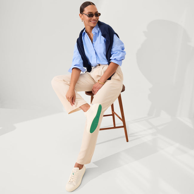 Alternate view of a model wearing The RS02 Sneaker in Courtside White.