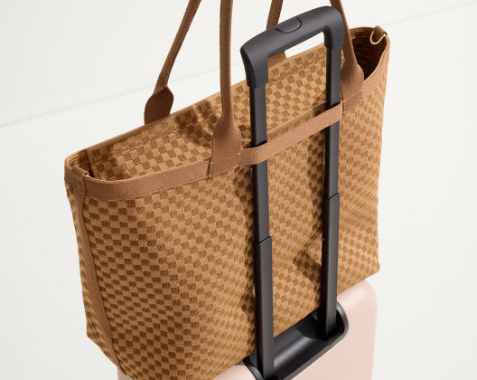 zip travel tote from the basketweave collection, showcasing a variety of vibrant colors for stylish travel.  