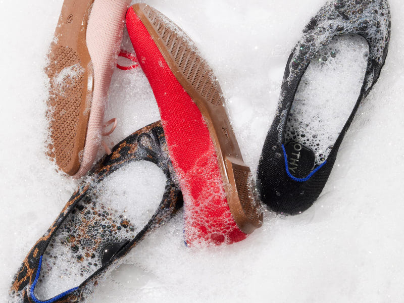 A closeup of some Ballet Flats in soap bubbles.