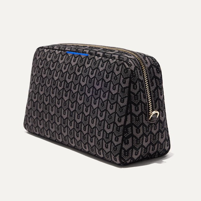 The Universal Pouch in Signature Black shown at a diagonal view from the right.