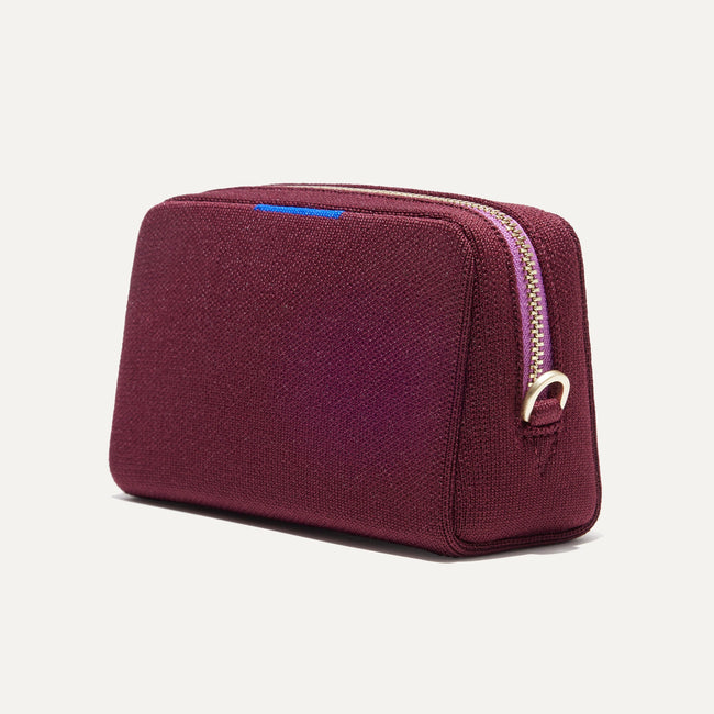 The Mini Universal Pouch in Collegiate Currant shown at a diagonal view from the right.