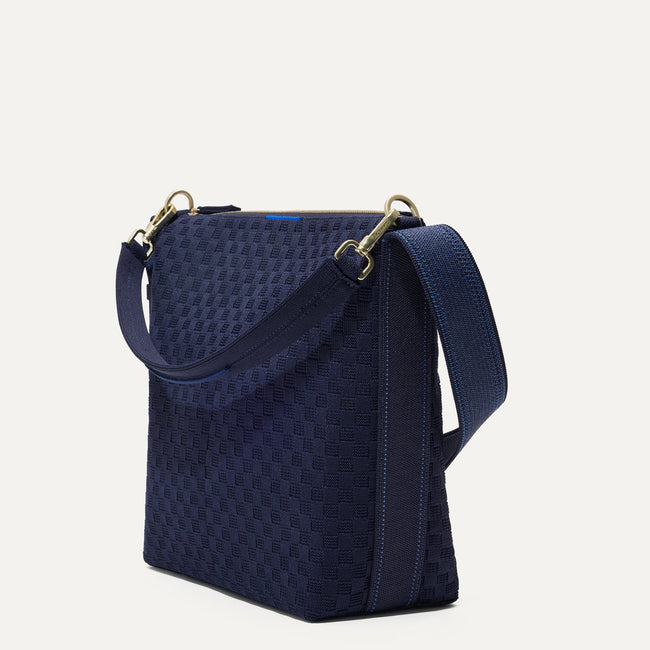 The Mini Zip Bucket in Nautical Navy shown at a diagonal view from the left.