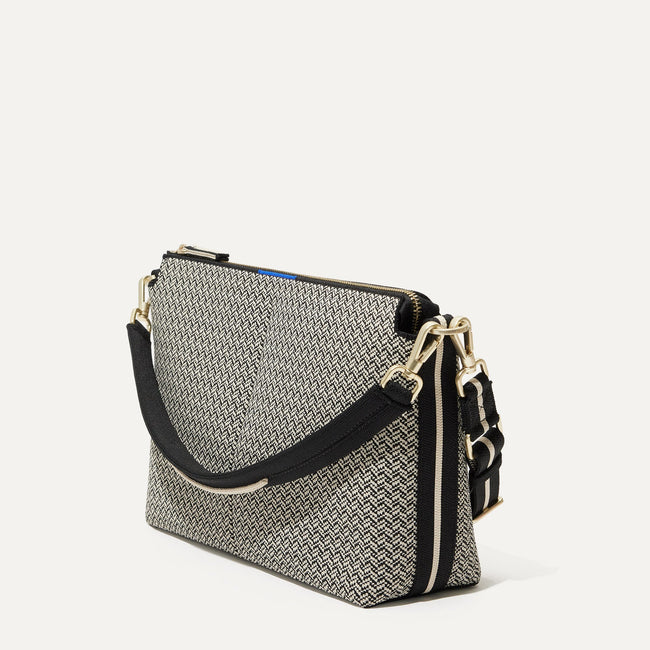 The Mini Zip Bucket in Black Mist Herringbone shown at a diagonal view from the left.