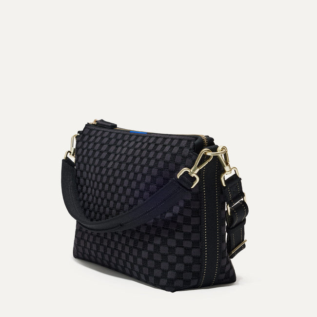 The Daily Crossbody Bag in Black Sand shown at a diagonal view from the left.
