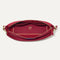 The Daily Crossbody Bag in Cranberry shown from the top down, with zipper open and interior exposed.