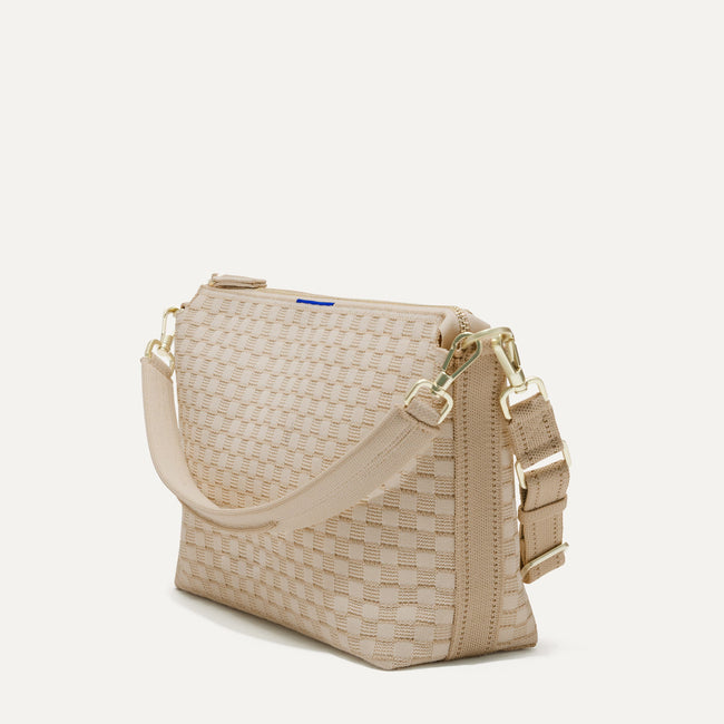 The Daily Crossbody Bag in Knot Brown shown at a diagonal view from the left.