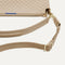 A closeup of The Daily Crossbody Bag in Knot Brown, showing the smooth zipper closure and soft, flexible handle.