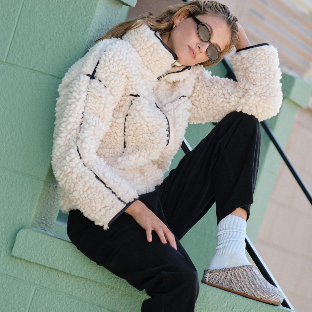 Model wearing The Cozy Clog in  Cookies and Cream Bouclé.