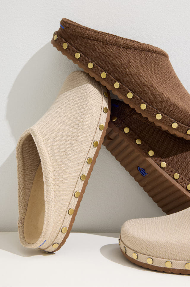 Pair of The Studded Casual Clog in       Studded Cinnamon and Studded Taupe on a white background.