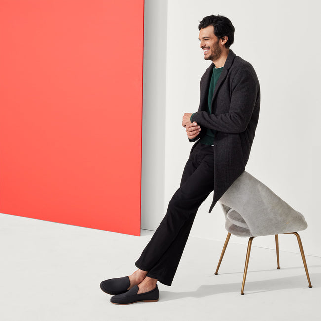 Alternate view of a model wearing The Ravello Loafer in Stone Black.