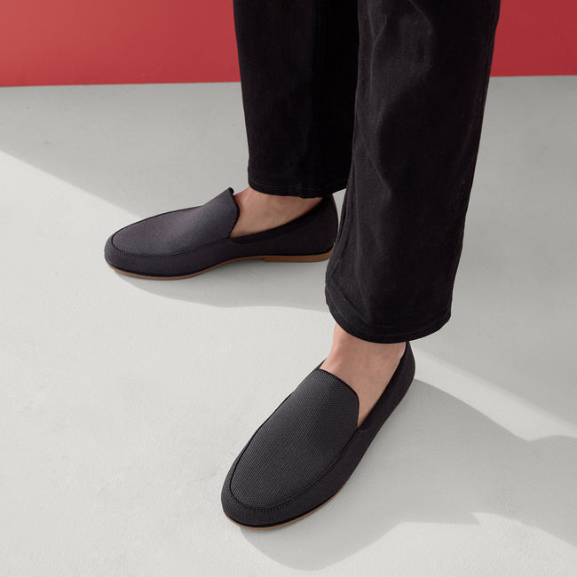 Model wearing The Ravello Loafer in Stone Black.