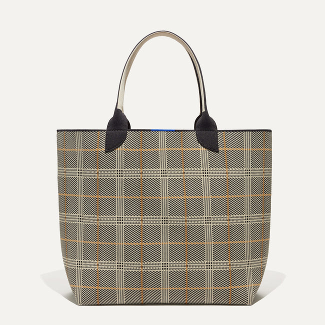 The Reversible Lightweight Tote in Black Glen Plaid shown from the front. 