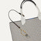 Close up of the handles and key leash detail of The Lightweight Tote in Black & White Checkers. 