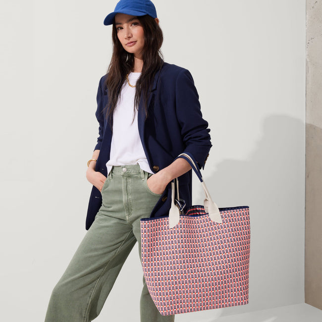An alternate view of model holding The Lightweight Tote in Navy & Pink Checkers.