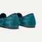 Close up of the heel of The Almond Loafer in Dark Jade, with Rothy's signature blue halo. 
