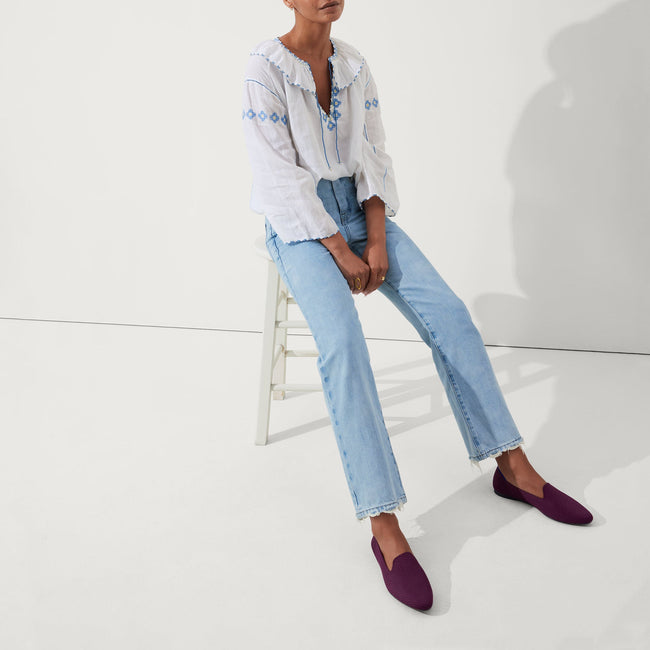 Alternate view of a model wearing The Almond Loafer in Plum Twill. 