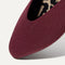 Close up of the almond toe of The Almond Demi in Black Cherry, shown in diagonal view. 