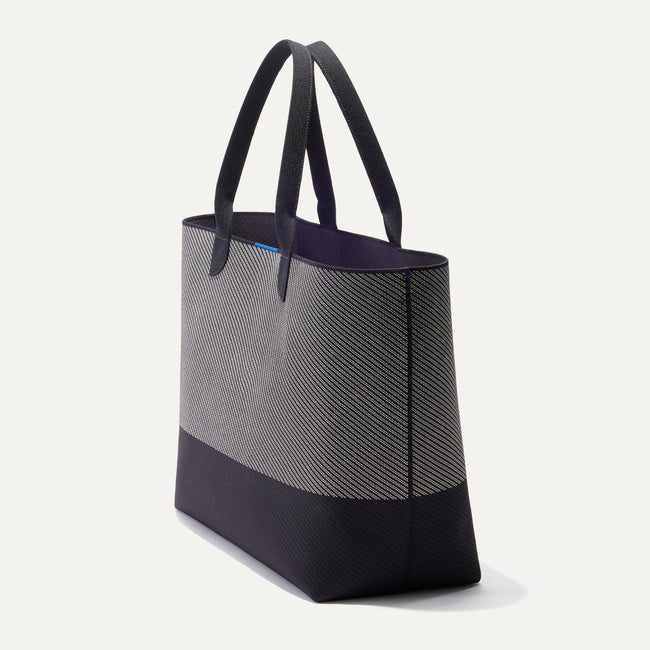 The Lightweight Mega Tote in Grey Mist Twill, shown from the side.