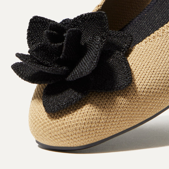 Close up of the square-shaped toe and rounded vamp of The Petal Square in Sand Soiree. 