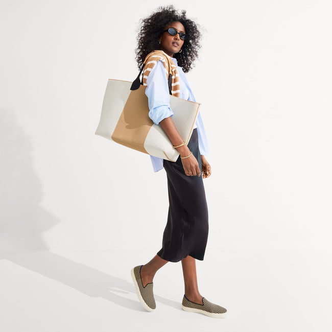 Alternate view of a model carrying the Lightweight Mega Tote in Camel Colorblock.