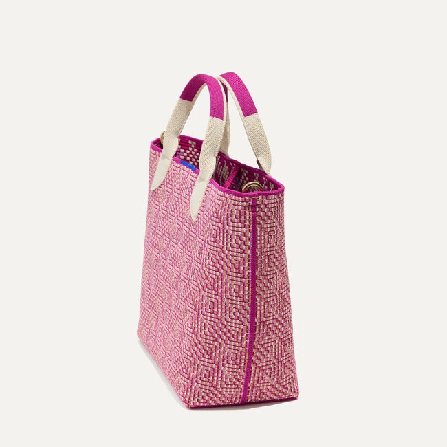 The Lightweight Petite Tote in Fuchsia Geo, shown from the side.
