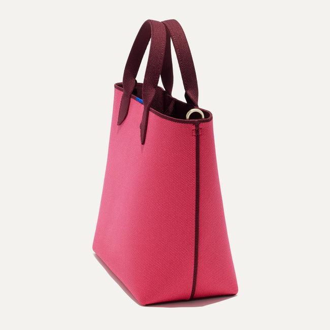 The Lightweight Petite Tote in Perfect Pink, shown from the side.