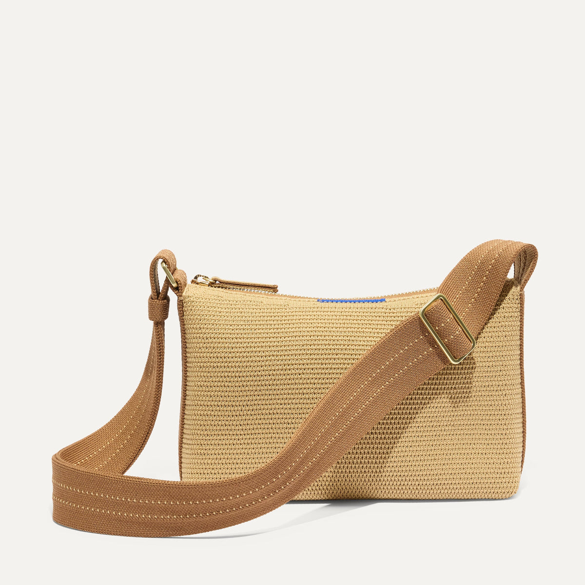 PDP |The Casual Crossbody in Brown Butter Raffia-Knit, shown from the front.