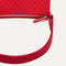 A closeup of The Casual Crossbody in Red Crisp Basketweave, focusing on the crossbody strap.