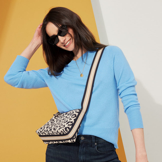 The Casual Crossbody in Sandy Cat, worn over the shoulder by a model, shown from the side.