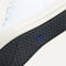 Outsole of The High Top Sneaker in hemp in Bright White shown from below, in diagonal view.