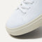 The toe and vamp of The High Top Sneaker in Hemp in Bright White, in diagonal view.