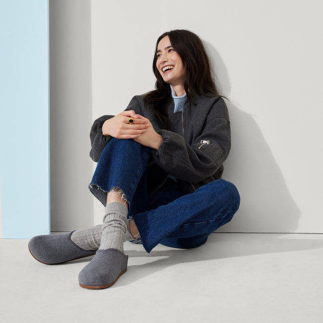 Model wearing The Casual Clog in Mountain Grey.