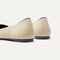 Close up of the heel of The Point II in Cream Herringbone, with Rothy's signature blue halo. 
