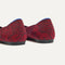 Close up of the heel of The Point II in Garnet Chantilly, with Rothy's signature blue halo. 