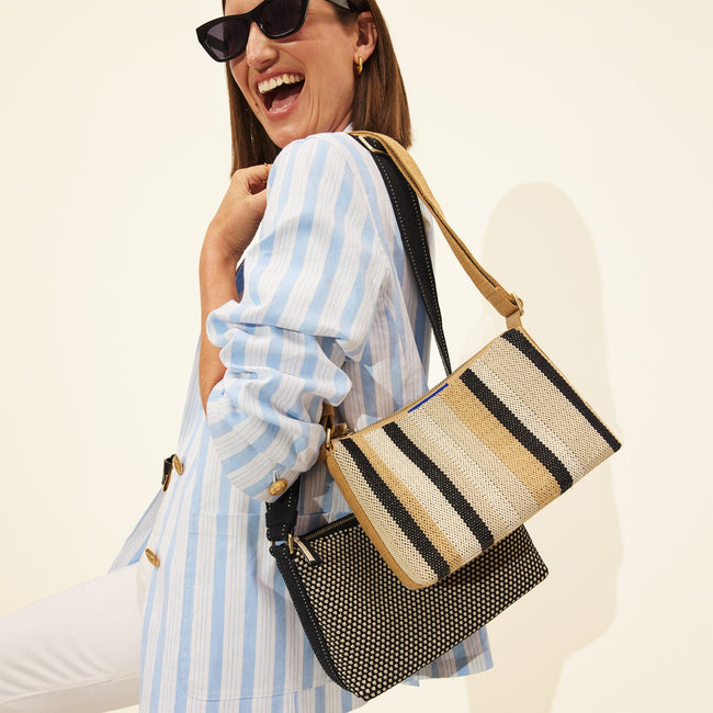The Casual Crossbody in Coco Stripe, worn over the shoulder by a model, shown from the side.