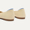 Close up of the heel of The Point II in Marzipan Woven, with Rothy's signature blue halo. 