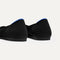 Close up of the heel of The Point II in Noir Mesh, with Rothy's signature blue halo. 