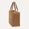 The Classic Tote in Hazelnut, shown from the side.