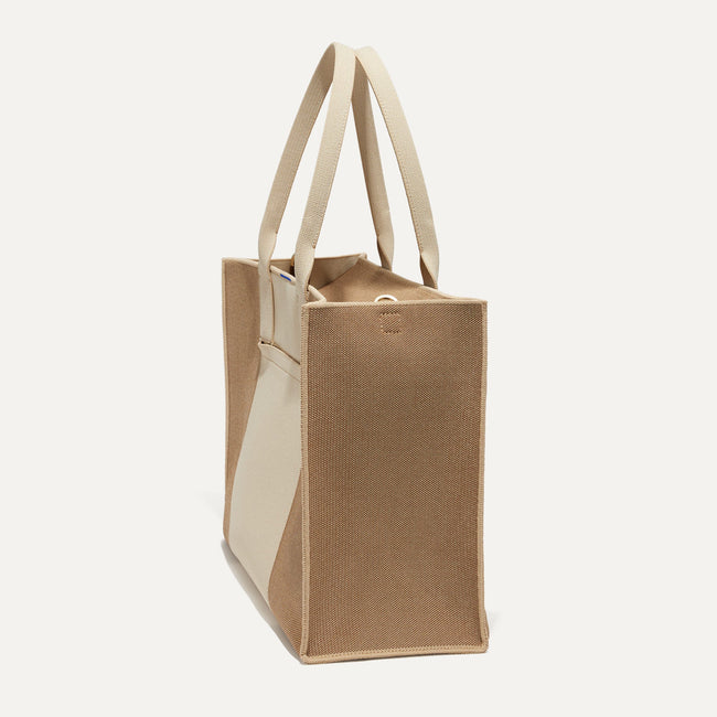 The Classic Tote in Soft Sesame, shown from the side.