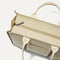 The Classic Tote in Buttercream, shown from above, with the top zipper closed. 